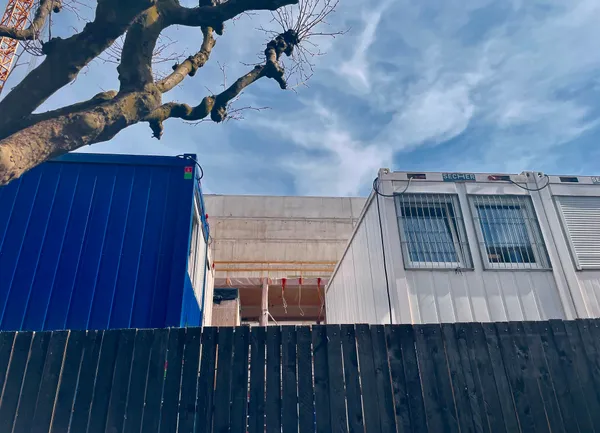 Working site from the National Archives with a blue and a white cabin, in Belval, Luxembourg.