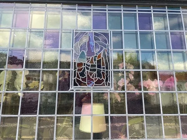 Pink stained glass in Bruges, Belgium.