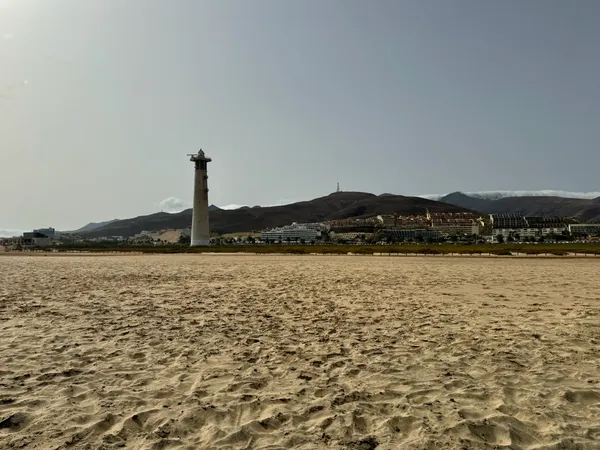 Playa del Matorral with lighthouse, in Morro Jable, Fuerteventura, Spain.