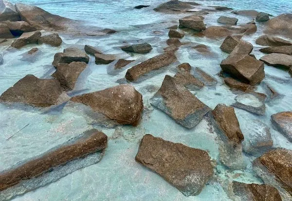 Rocks in aquamarine water in Punta Molentis, in Villasimius, Sardinia, Italy.